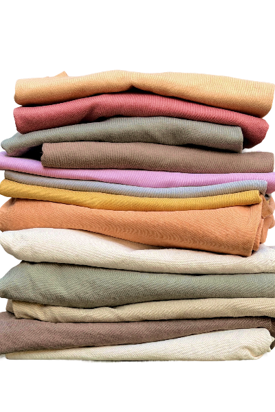 stack of botanically dyed organic cotton by four objects