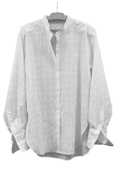 White organic cotton button-up shirt with windowpane weave on a hanger against a white background